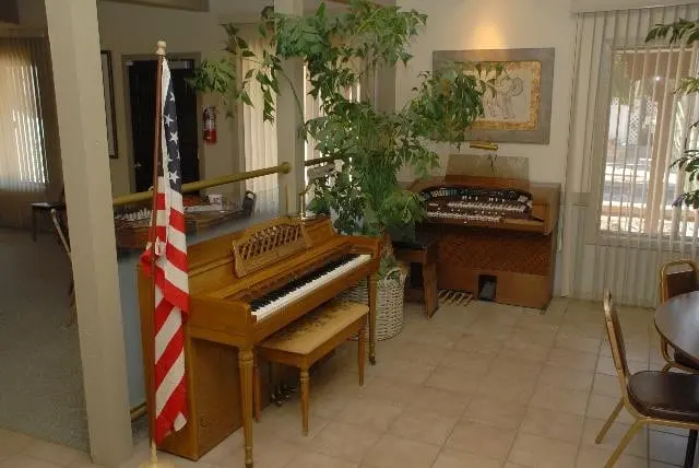 The clubhouse piano, organ, and flag in the recreation room